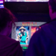 Ellie and Riley are shown getting ready to play a round of Mortal Kombat II on an arcade cabinet.